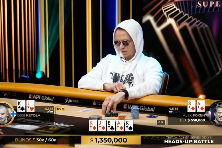 Ossi Monarch Ketola at Triton Poker tournament table wearing white hoodie and sunglasses